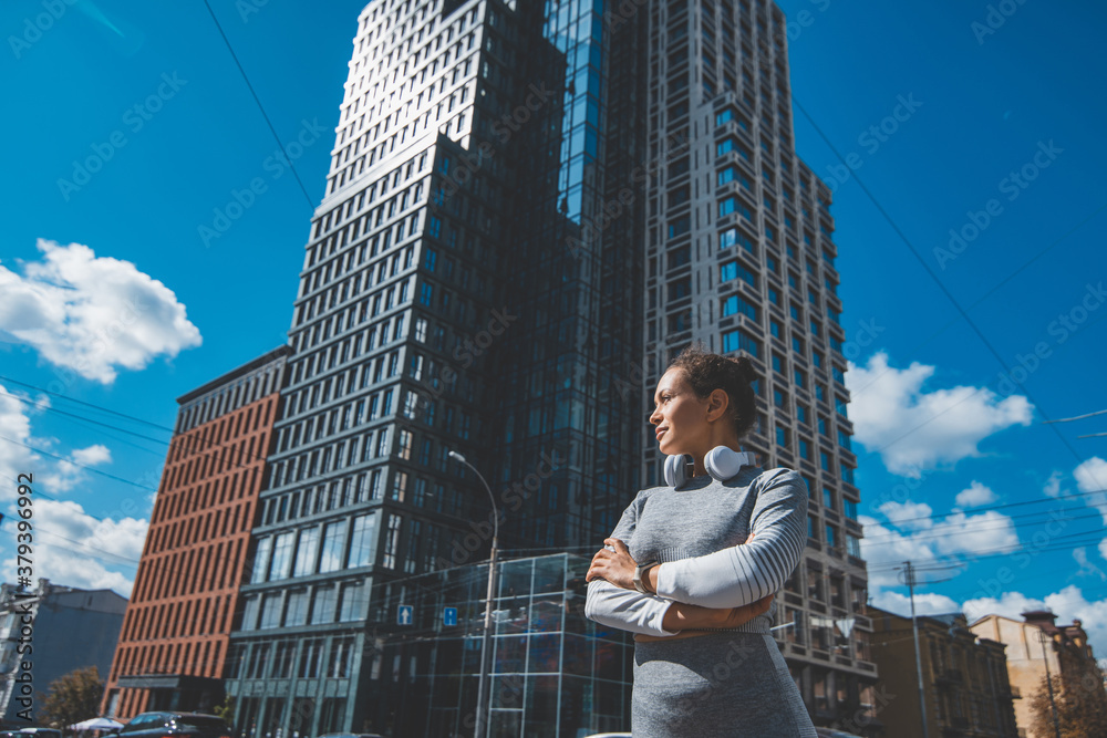 Fototapeta premium A young woman in tracksuit looking to the side