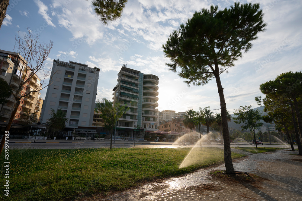 The beautiful cityscape of Albanian city Vlore, with cloudy blue sky.