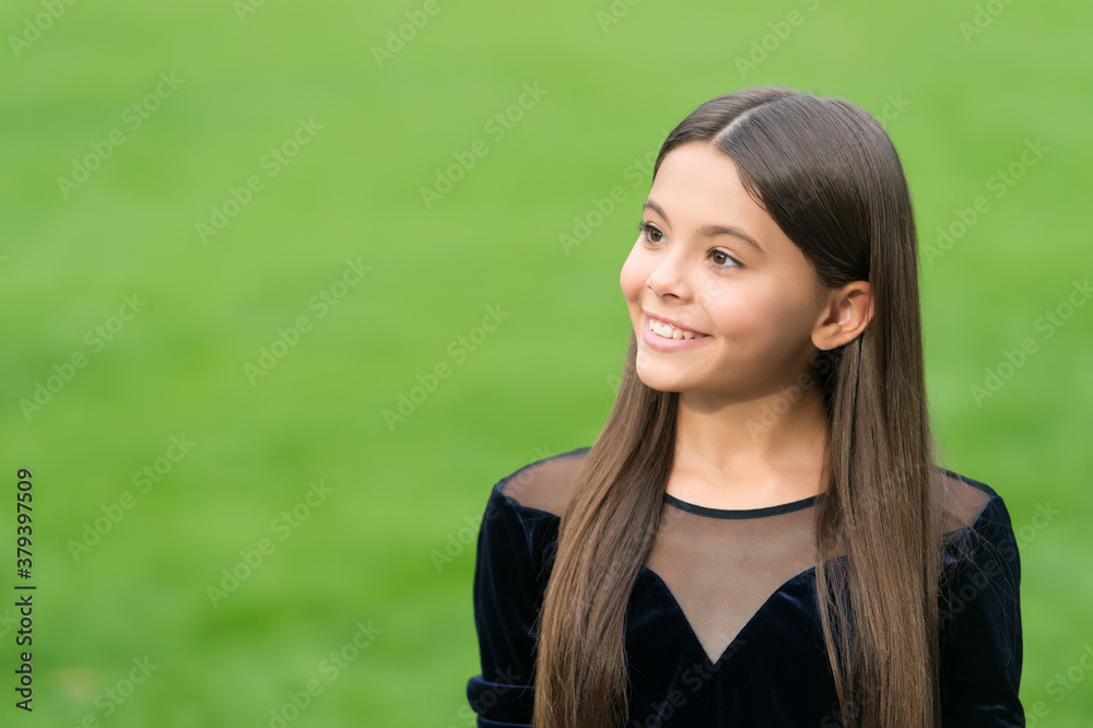 When I go to hairdresser I just marvel. Happy child wear long hair green grass. Hair salon. Summer haircare. Beauty salon. Natural cosmetics. Shampoo and conditioner. Share new perfection, copy space When I go to hairdresser I just marvel. Happy child wear long hair green grass. Hair salon. Summer haircare. Beauty salon. Natural cosmetics. Shampoo and conditioner. Share new perfection, copy space