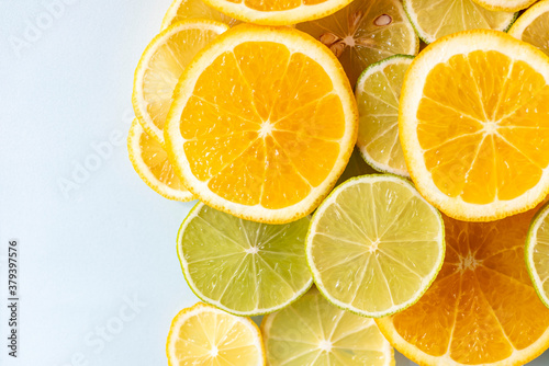 sliced colorful juicy assorted citrus  fruits shot from above flat lay