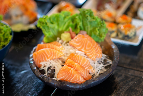 sliced salmon on iced in japanese restaurant