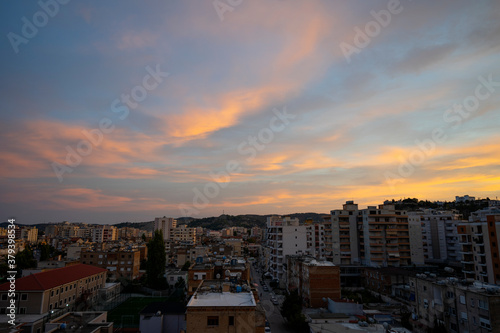 The beautiful cityscape of Albanian city Vlore, with cloudy blue sky.