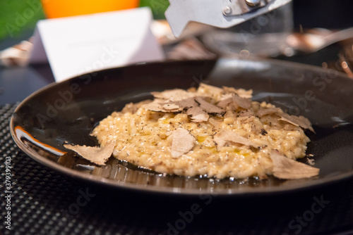 selective focus of risotto with sliced black truffle photo