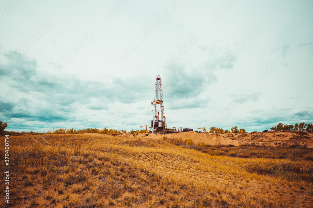 Drilling rig in oil field for drilled into subsurface in order to produced crude. Drilling rig in oil field for drilled into subsurface in order to produced crude.
