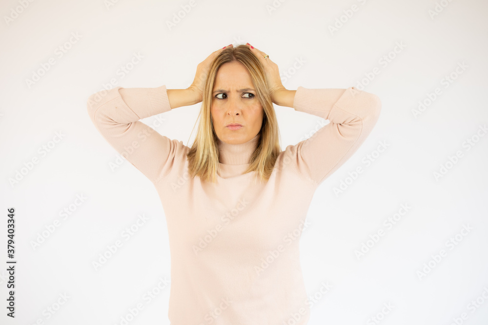 Close up isolated portrait of young annoyed angry woman holding hands in furious gesture.