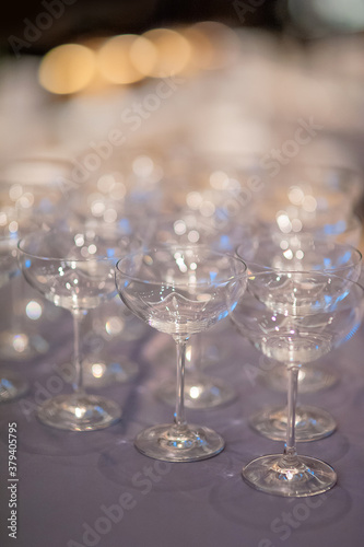 arrangment a lot of wine glassed in nightclub
