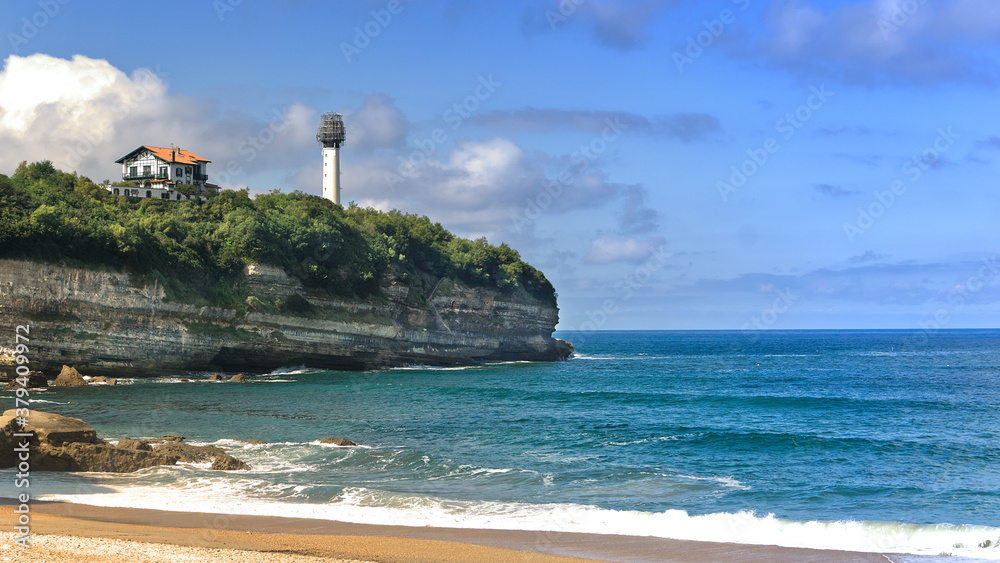 Cap of Biarritz lighthouse under construction with the cave of love chamber in foreground Cap of Biarritz lighthouse under construction with the cave of love chamber in foreground