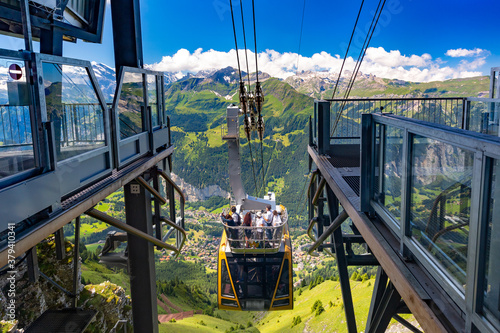 Cable car from mountain village Wengen to viewpoint on cliff in Mannlichen, Switzerland, Bernese Oberland Switzerland