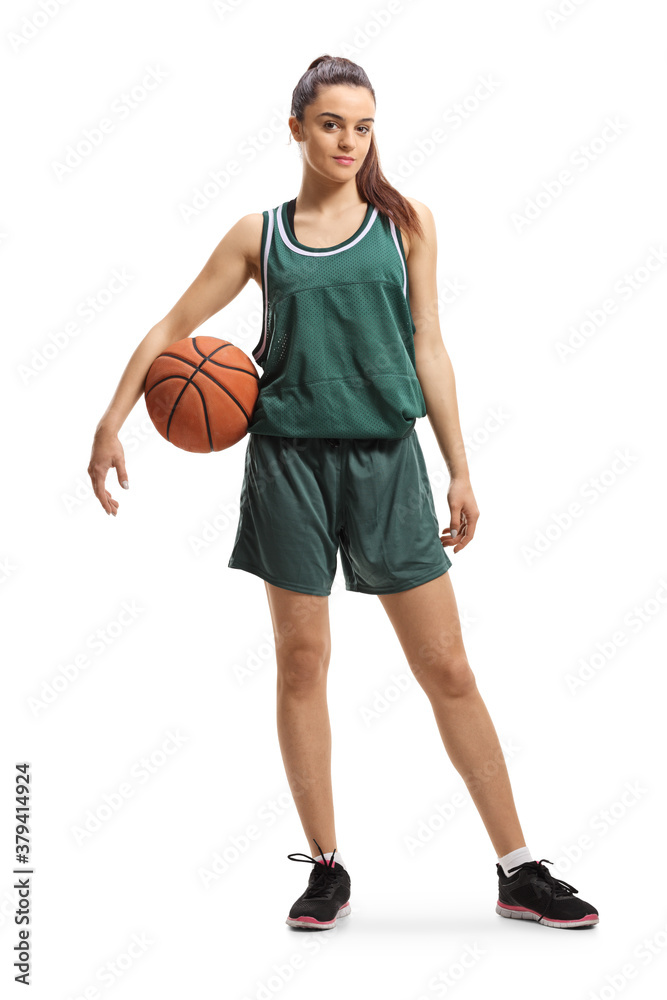 Full length portrait of a emale basketball player posing with a ball under arm Full length portrait of a emale basketball player posing with a ball under arm