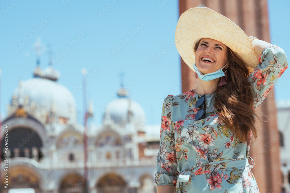 woman having excursion at San Marco square in Venice, Italy