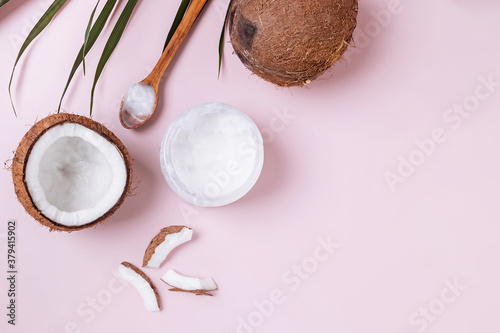 Healthy coconut oil on pink background