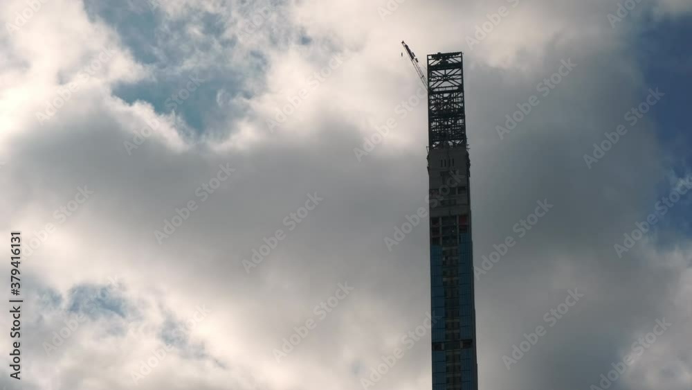 Billionaires Row Tower Construction Silhouette Against A Cloudy Sky Billionaires Row Tower Construction Silhouette Against A Cloudy Sky