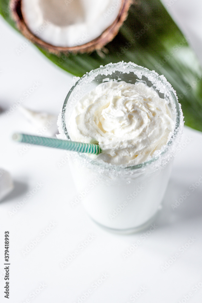 cocktail with coconut on white background cocktail with coconut on white background