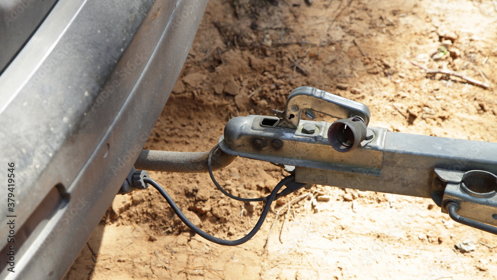 Car tow hitch with trailer lock handle and electrical socket close up