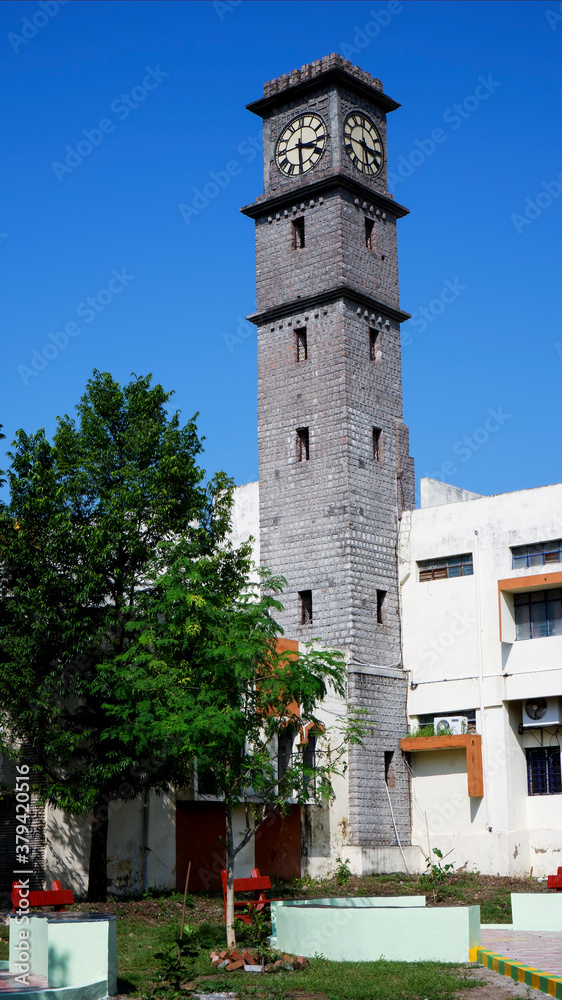 gulbarga university library clock tower isolated in blue sky