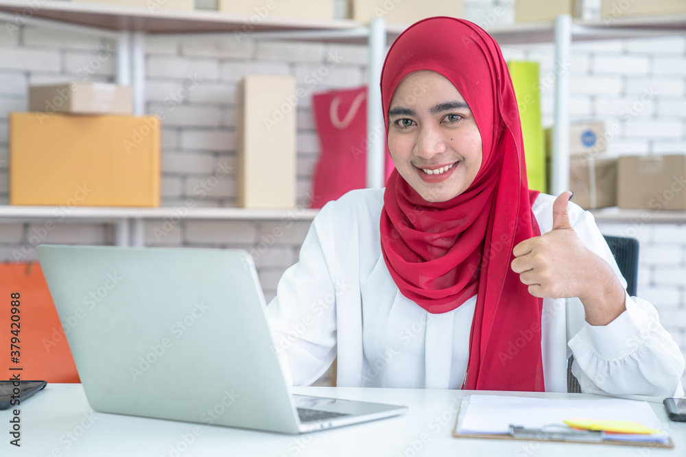 Asian Muslim women who work in modern offices.
