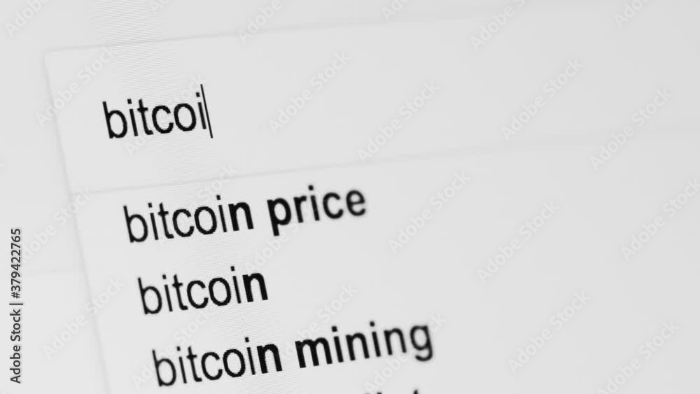 Generic internet search bar looking for the term 'BITCOIN' shot close up at an angle.