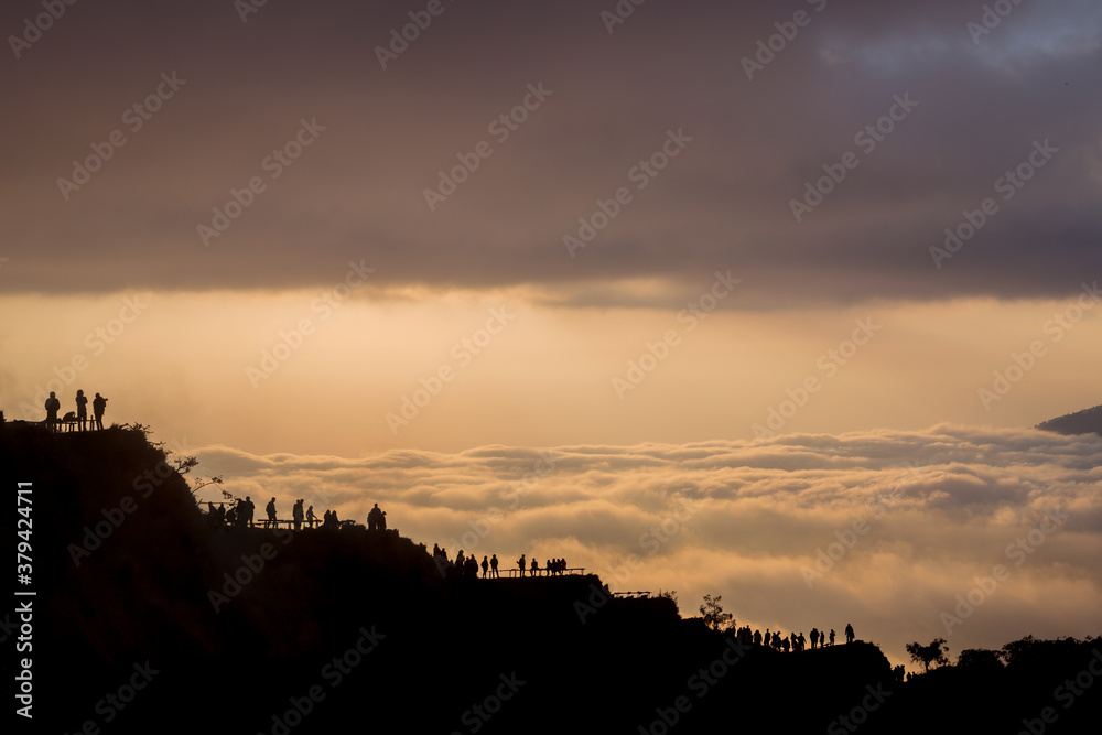 Scenic view of clouds and mist at sunrise