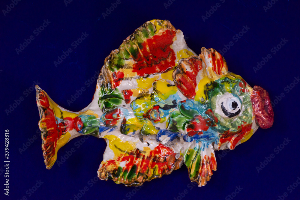 Multicolored crock fish isolated on background. Aquarium concept
