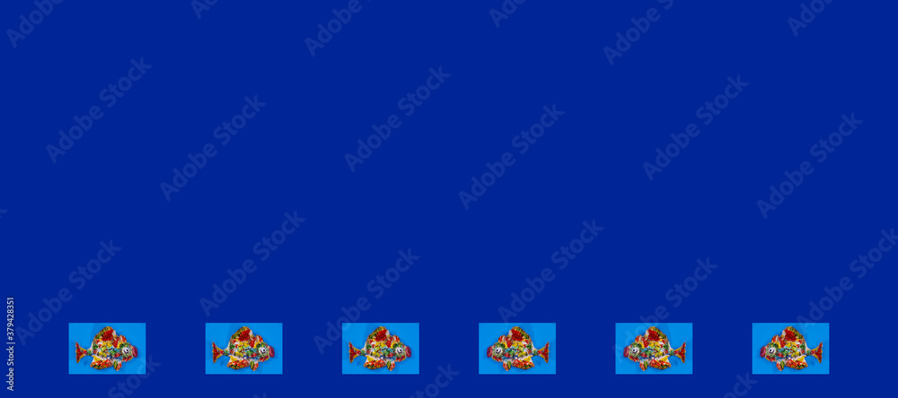 Multiple multicolored crock fish isolated on background. Aquarium concept