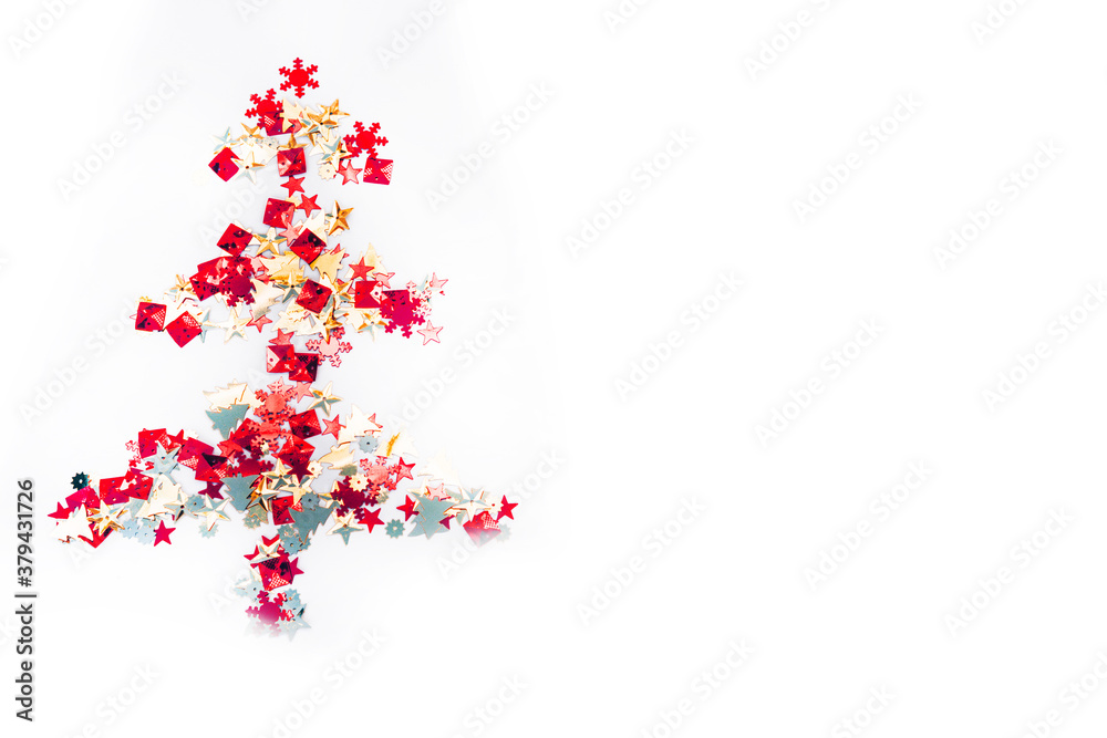 Shiny Christmas tree isolate. Figure of a Christmas tree on a white background of shiny multi-colored confetti. Happy new year and merry Christmas.