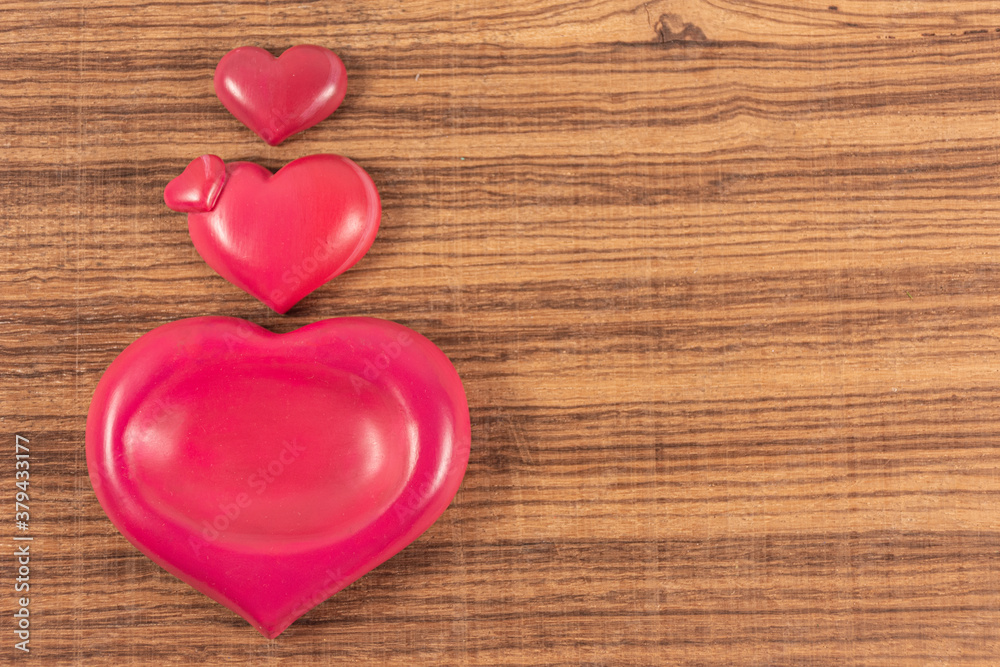 Pink hearts lined up on background with space for writing Pink hearts lined up on background with space for writing