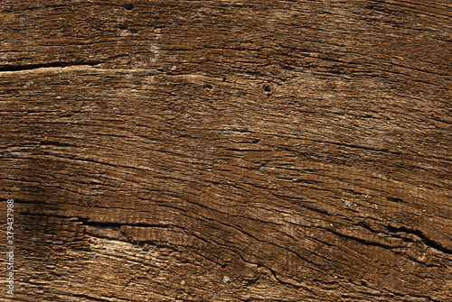 The background is made of old weathered unpainted wood. 1