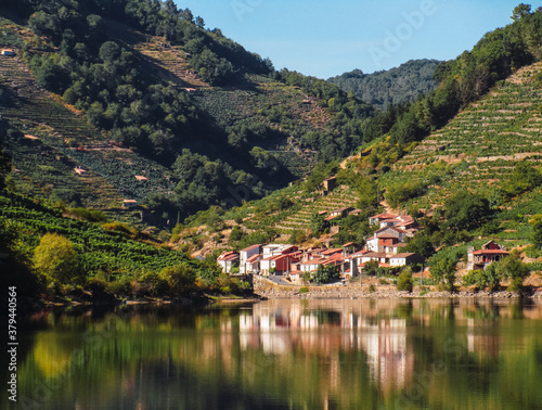 reflection in the water of a town on the slopes