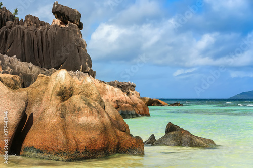 Coastal rocks, towering over the ocean, in the Seychelles.