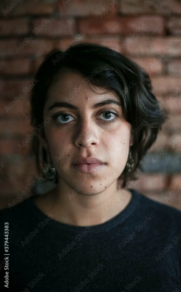 Portrait of beautiful young latin woman with angry and furious face. Human expressions and emotions Portrait of beautiful young latin woman with angry and furious face. Human expressions and emotions