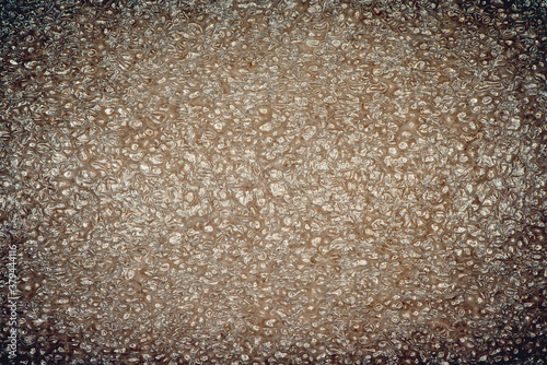 Brown grunge plastic texture closeup photo background.
