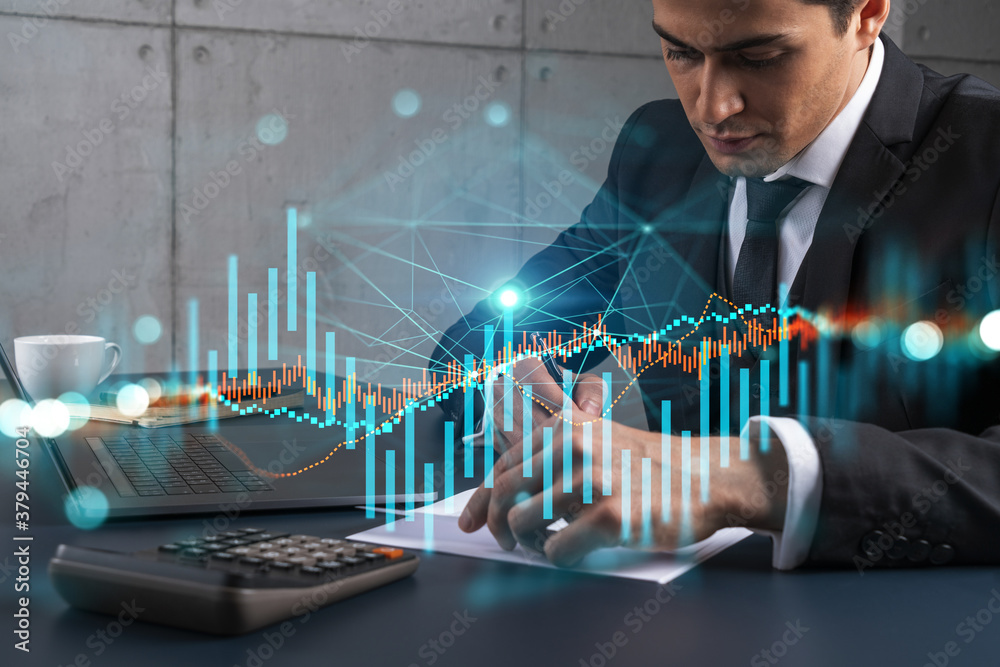 A businessman in office taking notes using phone and stock graph hologram. Multiexposure. Formal wear. A businessman in office taking notes using phone and stock graph hologram. Multiexposure. Formal wear.