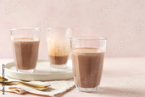 glass of milk and chocolate protein shake