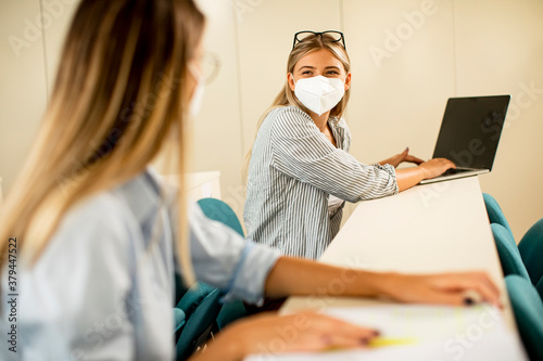 Female student wearing face...