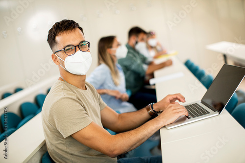 Male student wearing face p...