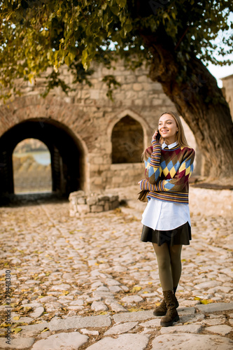 Pretty young woman standing...