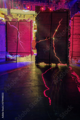 Canvas Print View from  the backstage of a theater, red lights brakes through the decorations