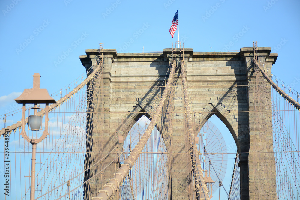 Fototapeta premium New York, NY, USA - June 3, 2019: Brooklyn Bridge connects Manhattan and Brooklyn