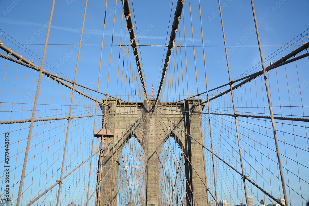 Fototapeta premium New York, NY, USA - June 3, 2019: Brooklyn Bridge connects Manhattan and Brooklyn