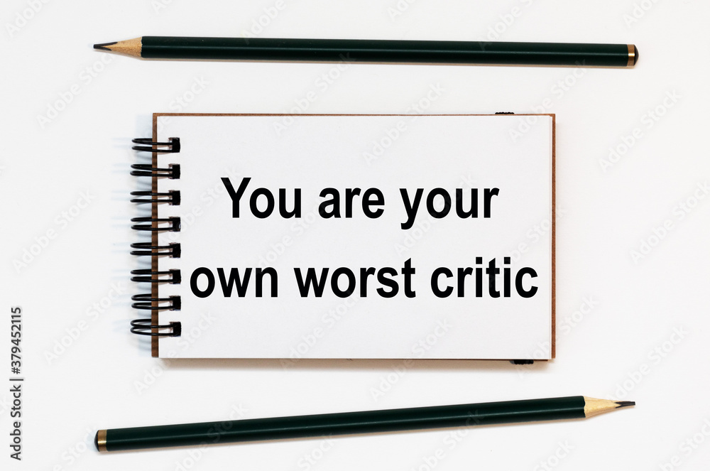 WHITE SPIRAL NOTEBOOK, TWO PENCILS WITH TEXT you are your own worst critic WHITE SPIRAL NOTEBOOK, TWO PENCILS WITH TEXT you are your own worst critic