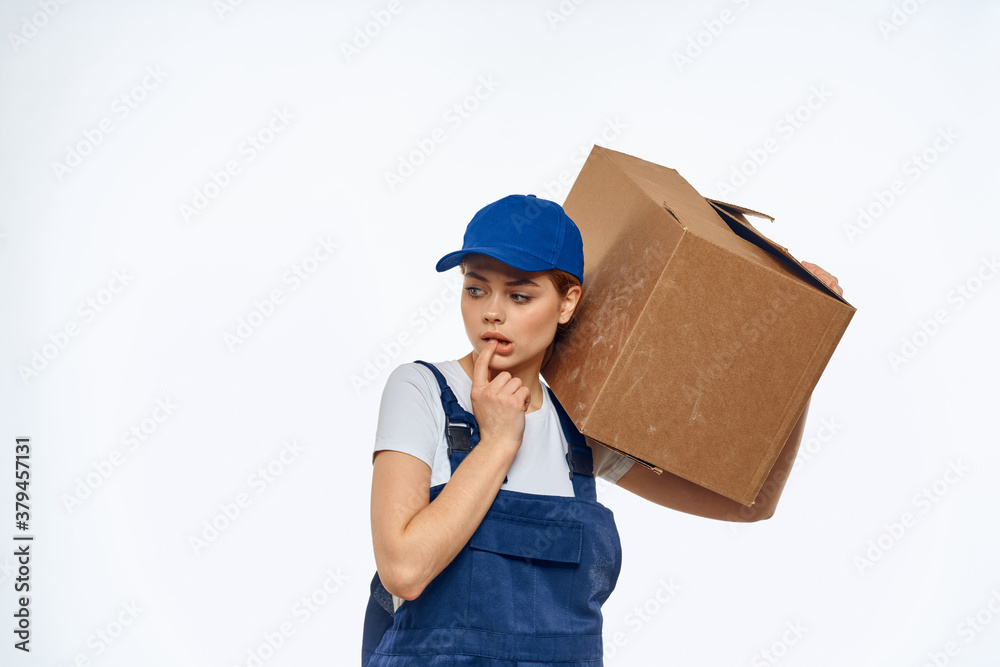 Woman working uniform box in hands packing service light background Woman working uniform box in hands packing service light background