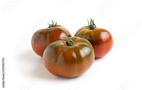 Three tomatoes isolated from the white background