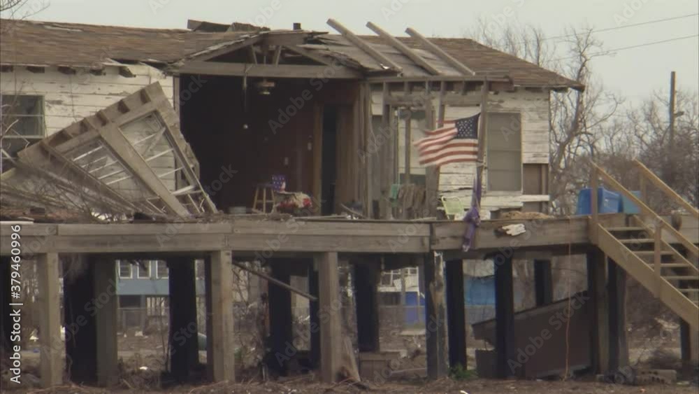 Medium shot, American Flag by destroyed house after Hurricane Ike Medium shot, American Flag by destroyed house after Hurricane Ike