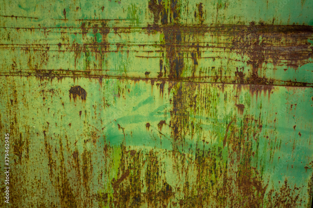 rust texture on metal door with green paint