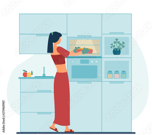 Woman baking dessert in kitchen at home