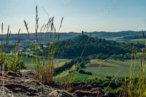 view on castle ruin vetzberg and duensberg mountain with a buitiful ladscape panorama. view  from the medieval castle ruin gleiberg near giessen, hesse, germany photo