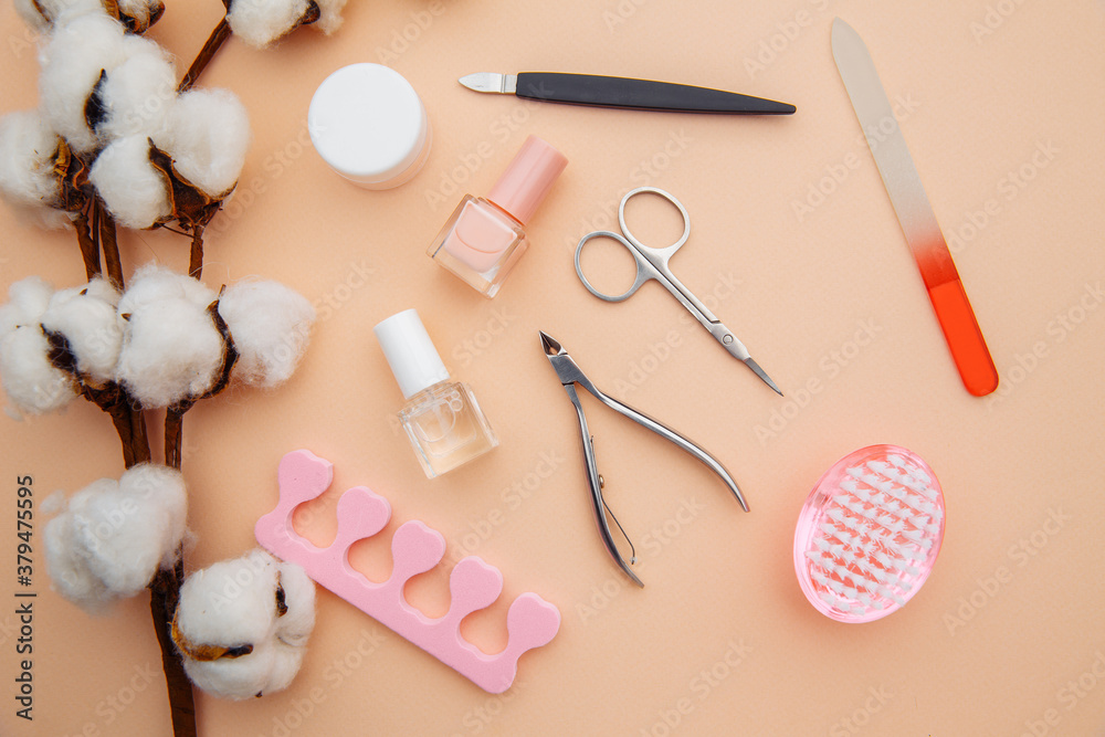 Beauty care. Tools for creating and for the treatment of nails on pink table. Top view. Beauty care. Tools for creating and for the treatment of nails on pink table. Top view.
