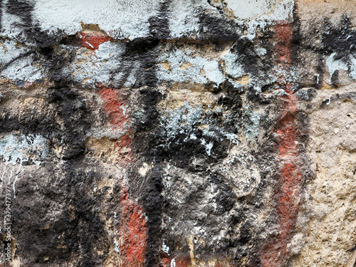 Multi-colored old paint on stone surface, as textured background. Vintage colorful background texture. Interior design texture and balckgound