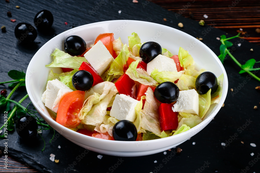 Greek salad with feta, cherry tomatoes and black olives Greek salad with feta, cherry tomatoes and black olives