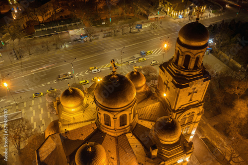Varna, Bulgaria - January 22, 2019: Assumption Cathedral of Modern Byzantine style with golden domes illuminated by night. Aerial view of the Dormition of Mother of God Cathedral in Varna at night